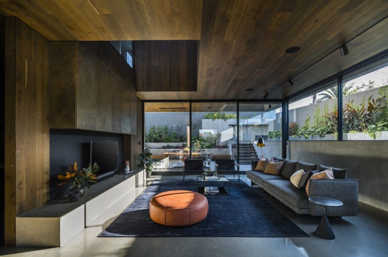 family huddled in their house an extension increased it to 800 square meters 03144b8